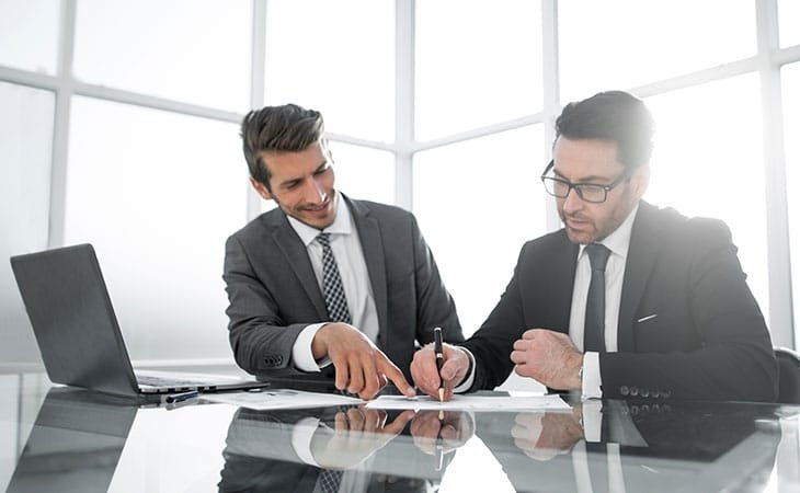 two businessmen working
