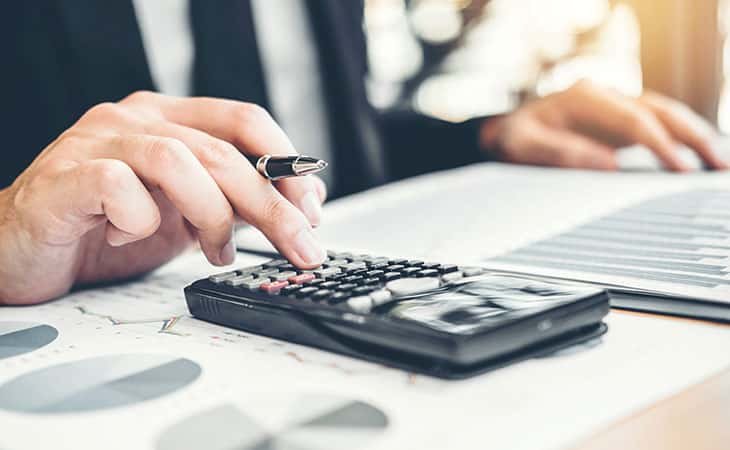 man using a calculator