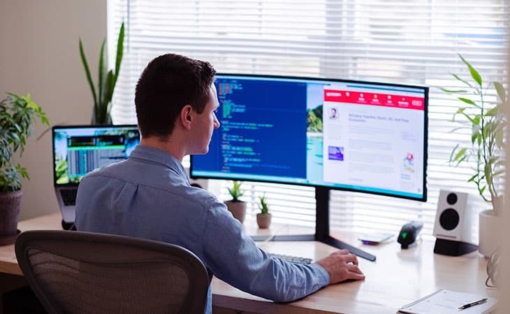 man working with his computer
