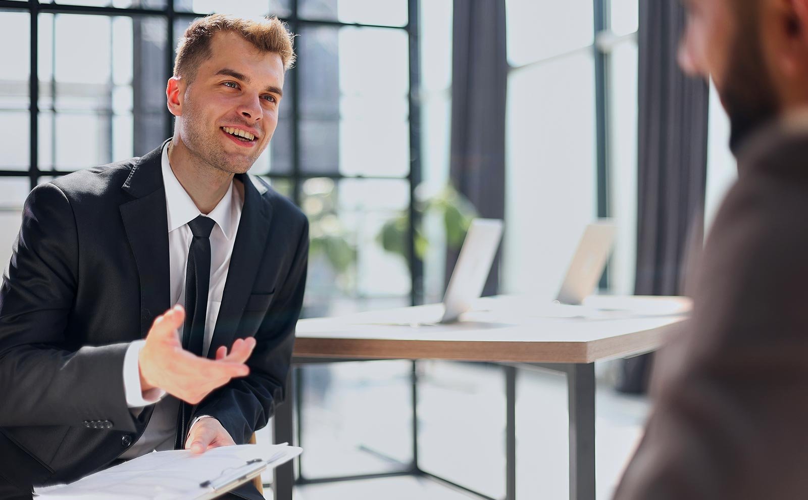 men talking suit office