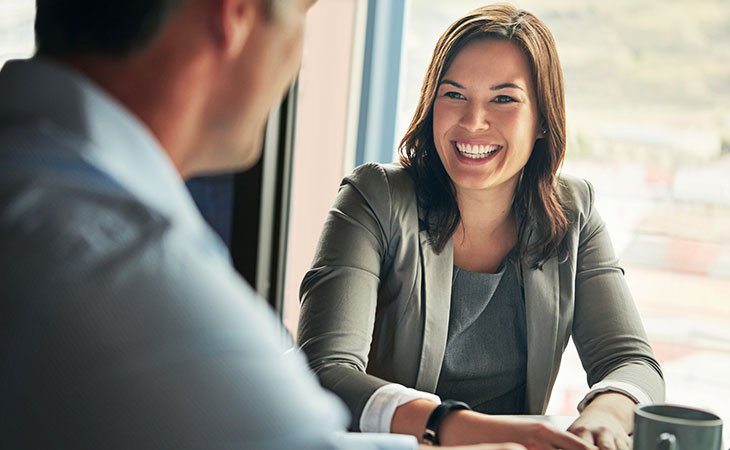 How To Find A Job: Expert Guide For Mastering Job Hunting Independent Recruiter LLC | Staffing Agency smiling-woman-talking-man-window