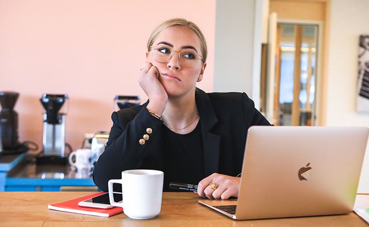 How To Decline A Job Offer | 20+ Tips &Amp; Sample Scripts Independent Recruiter LLC | Staffing Agency bored-woman-hand-face-laptop
