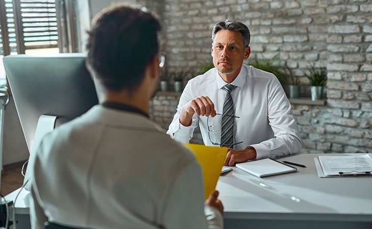 How To Decline A Job Offer | 20+ Tips &Amp; Sample Scripts Independent Recruiter LLC | Staffing Agency man-looking-another-man-glasses