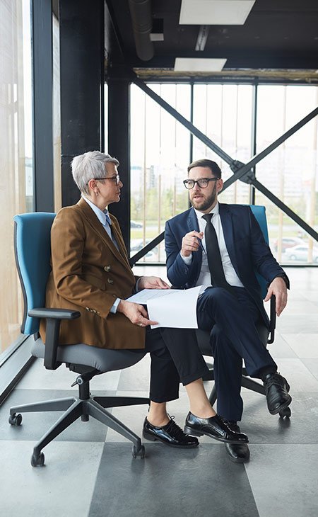 man-woman-talking-chair-indoors