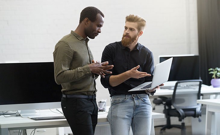 Java Developer Job Description: Skills &Amp; Responsibilities Independent Recruiter LLC | Staffing Agency men-talking-potinting-laptop