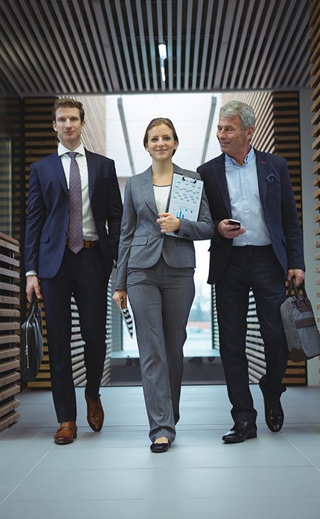 three-business-people-walking