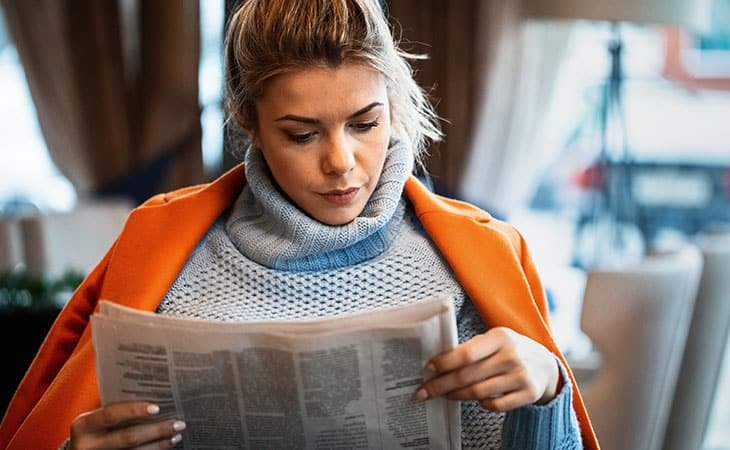 woman-reading-newspaper