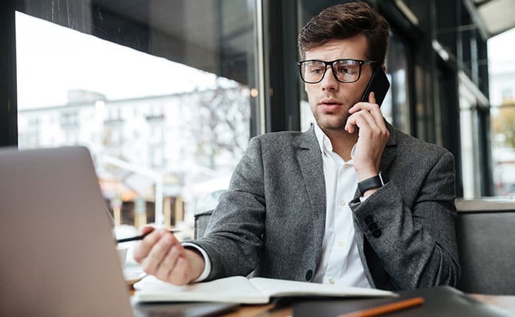 man-working-laptop-phone
