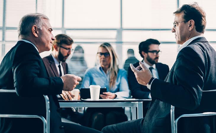 people-meeting-executives-table