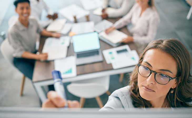 people-meeting-woman-writing-board