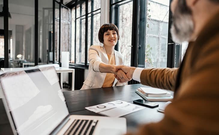 woman-man-handshake-computer