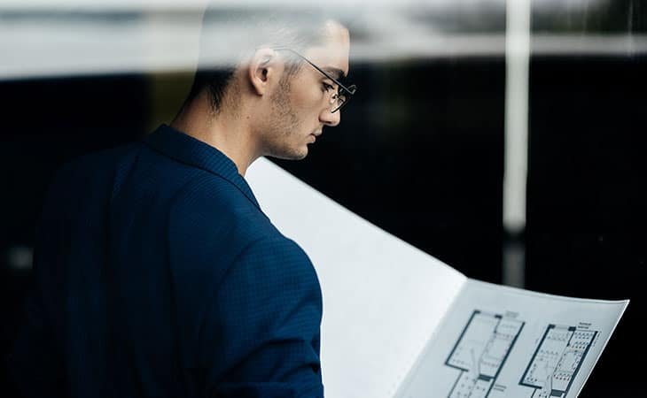 man-reading-blueprint