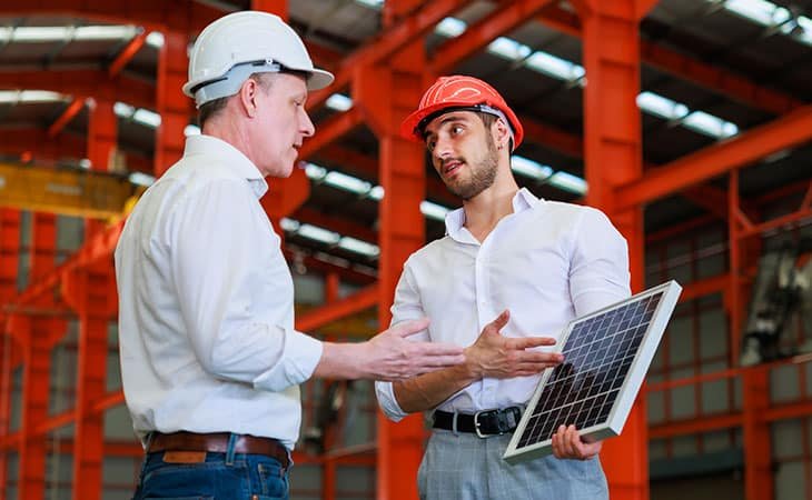 men-discussing-solar-panel