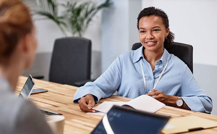 smiling-woman-talking-interview