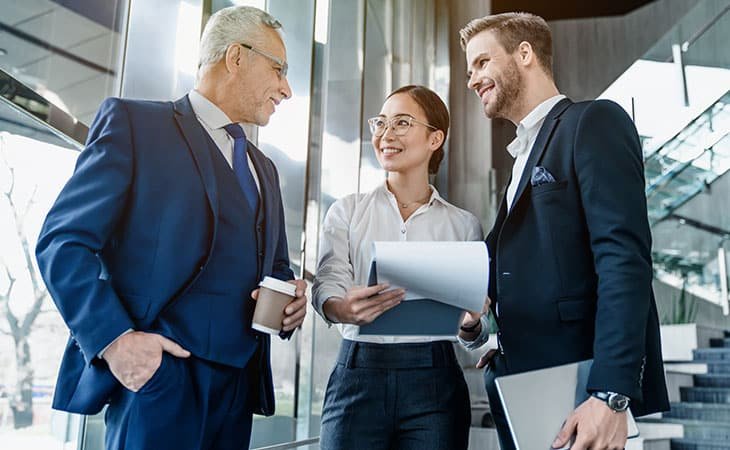 three-business-people-talking