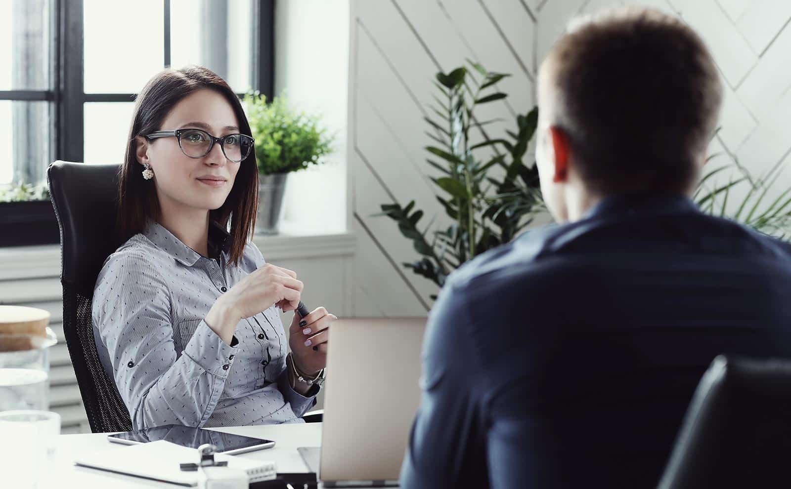 woman-looking-man-interview