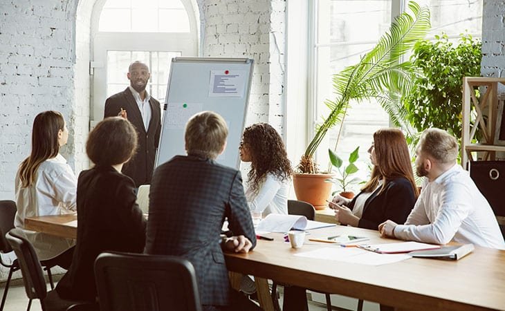 man-speech-board-group-people