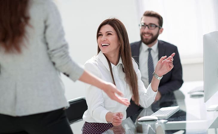 a smiling woman in an office
