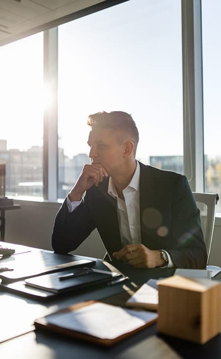 a thoughtful businessman in an office