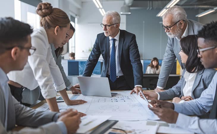 group of business workers discussing an issue