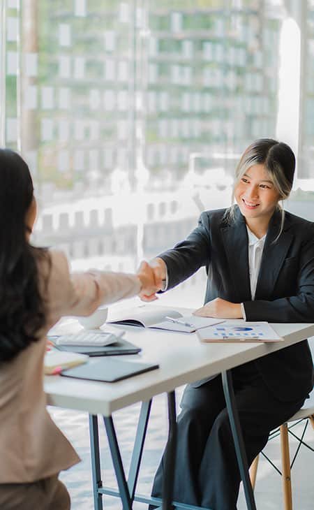 women-job-interview-handshake