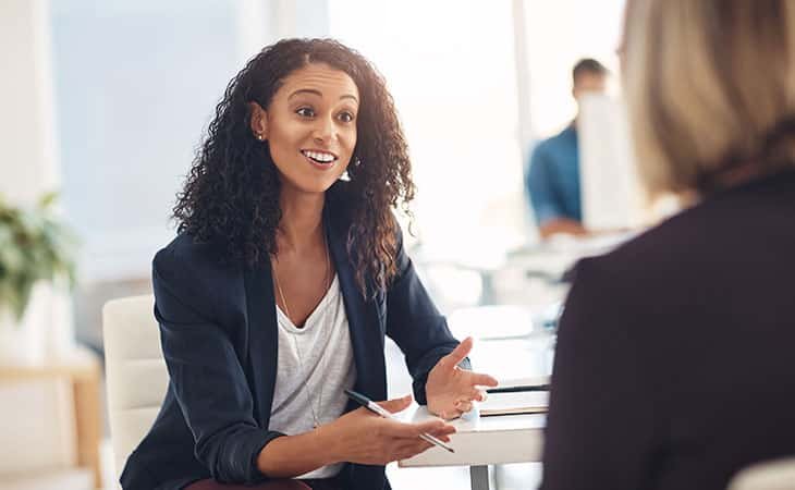 women-smiling-talking