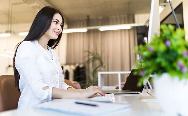 woman using a laptop in an office