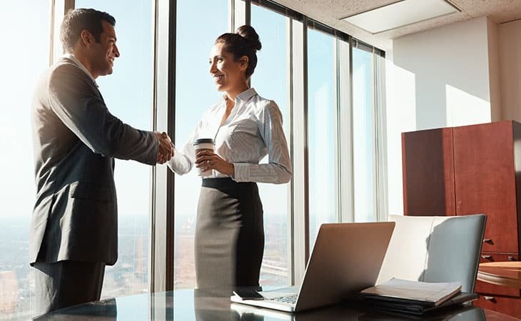 a man and a woman shaking hands