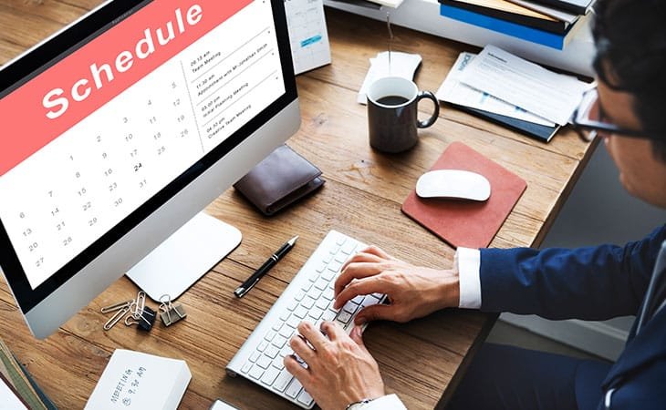 man-using-computer-schedule