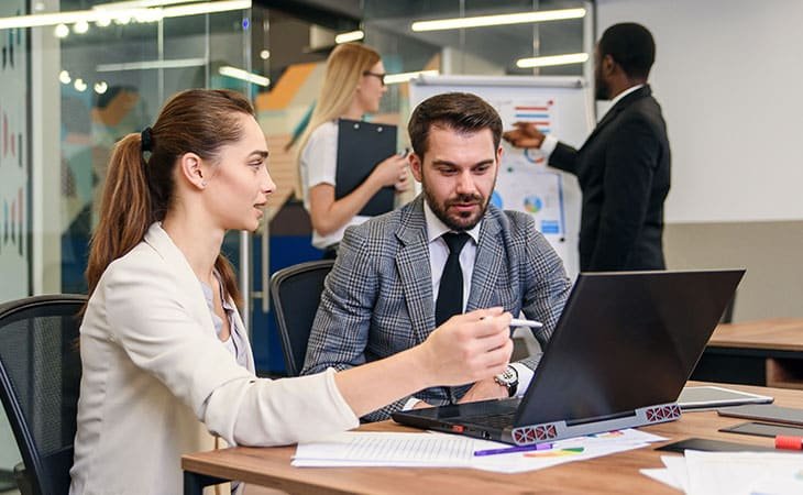 people-talking-office-laptop-papers