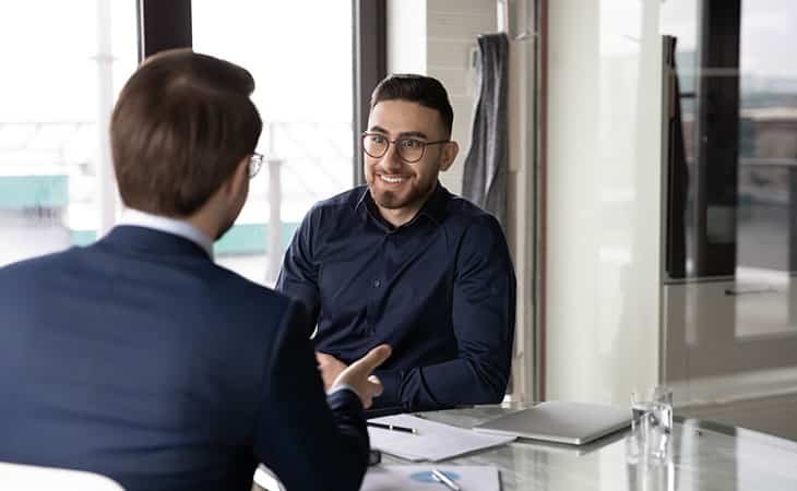 a man interviewing a young man
