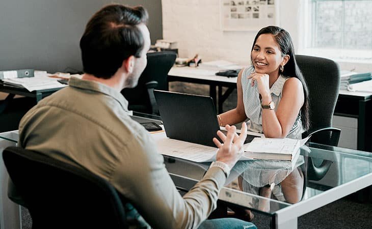 a woman and a man having an interview