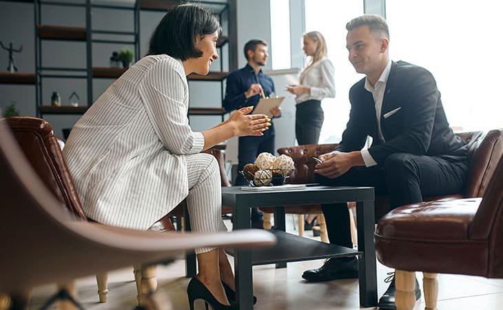 people talking at a table and people in the background